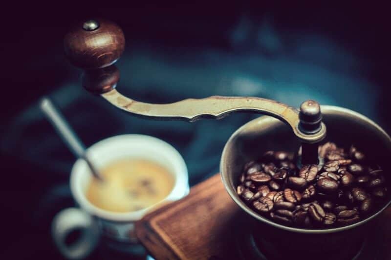 Grinding coffee beans before brewing in french press